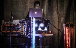 Composer Troy Rogers performs with the robotic musical instruments Stemmetje (a vocal robot), AMI (Automatic Monochord Instrument), CARI (Cylindrical Aerophone Robotic Instrument), and MADI (Multi-mallet Automatic Drumming Instrument).